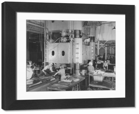 Framed Photo. Women working heavy machinery at an aircraft