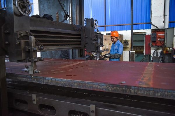 The worker is so carefully #processing the #machine parts.The whole #steel plate...